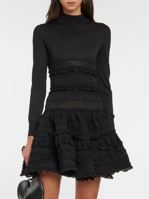 chic maxi Mimi dresses with slitsRuffled Paneled Knit Mini Dress in Black